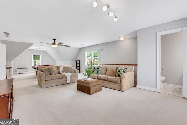 2535 Winthrope Way, Lawrenceville, GA 30044 - carpeted living area featuring healthy amount of natural light, a ceiling fan, vaulted ceiling, and baseboards