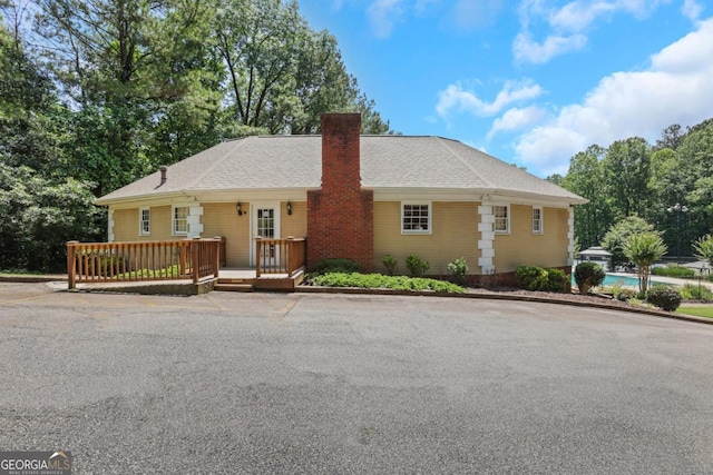 2535 Winthrope Way, Lawrenceville, GA 30044 - ranch-style house featuring a chimney and a deck