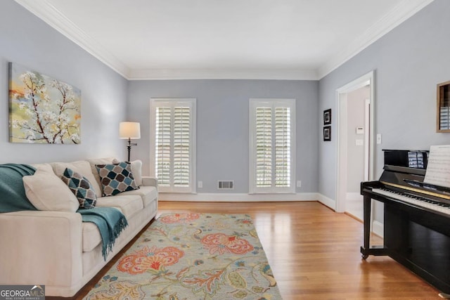 2535 Winthrope Way, Lawrenceville, GA 30044 - living area with ornamental molding, light wood-type flooring, and baseboards