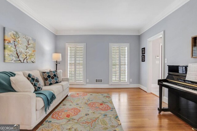 2535 Winthrope Way, Lawrenceville, GA 30044 - living room featuring crown molding and light wood-style floors