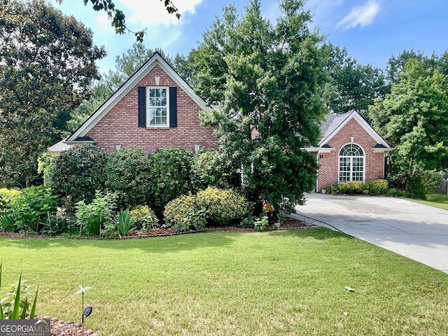 1902 Commons View Cir, Snellville, GA 30078 - traditional-style house featuring brick siding, a front lawn, and concrete driveway