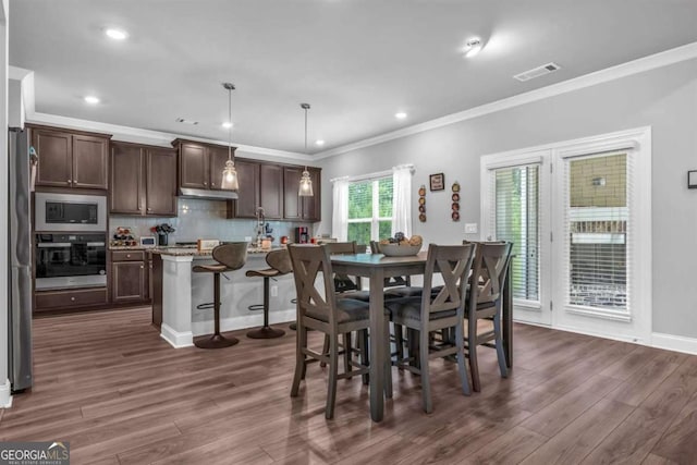 51 Waterfowl Ct, Jefferson, GA 30549 - dining room featuring crown molding, dark wood-type flooring, and recessed lighting