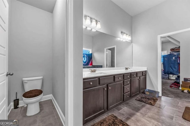 51 Waterfowl Ct, Jefferson, GA 30549 - full bath featuring double vanity, a walk in closet, and tile patterned floors