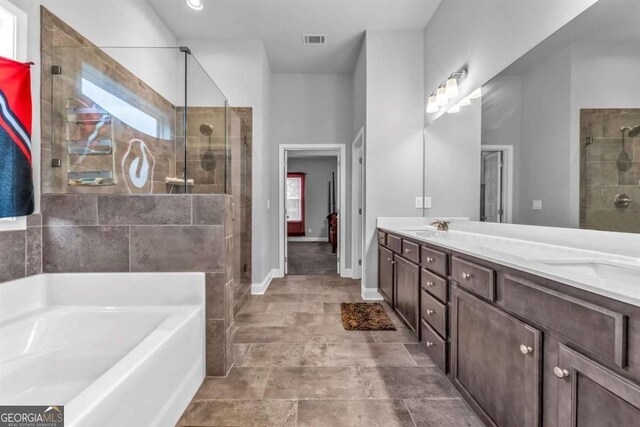51 Waterfowl Ct, Jefferson, GA 30549 - full bathroom with a garden tub, a shower stall, and double vanity