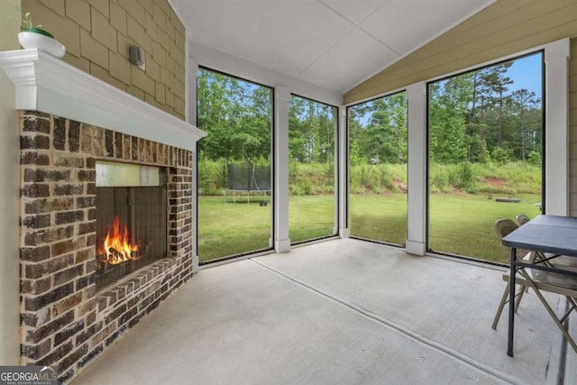 51 Waterfowl Ct, Jefferson, GA 30549 - unfurnished sunroom with a fireplace and lofted ceiling