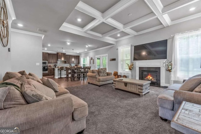 51 Waterfowl Ct, Jefferson, GA 30549 - living area with recessed lighting, crown molding, a glass covered fireplace, and beamed ceiling