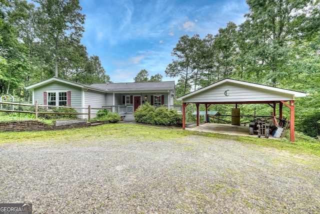 311 Lonesome Pine Trl, Blairsville, GA 30512 - view of front facade featuring a detached carport, driveway, and a porch