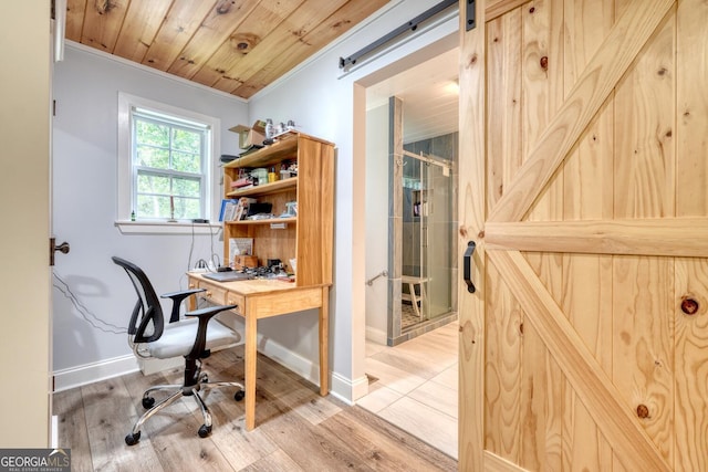 311 Lonesome Pine Trl, Blairsville, GA 30512 - office area featuring a barn door, baseboards, ornamental molding, light wood-style floors, and wood ceiling
