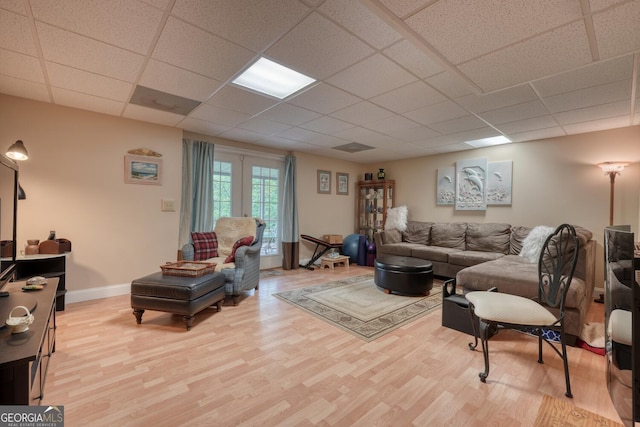 311 Lonesome Pine Trl, Blairsville, GA 30512 - living room featuring light wood-style floors, a paneled ceiling, and baseboards