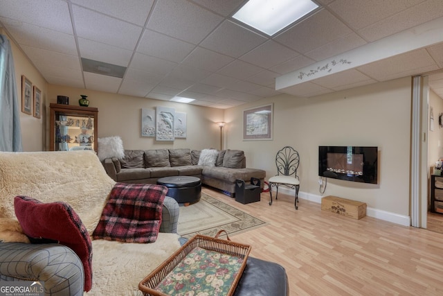 311 Lonesome Pine Trl, Blairsville, GA 30512 - living area featuring a paneled ceiling, wood finished floors, and baseboards