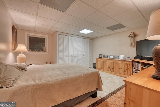 311 Lonesome Pine Trl, Blairsville, GA 30512 - bedroom with a paneled ceiling, light carpet, and concrete block wall