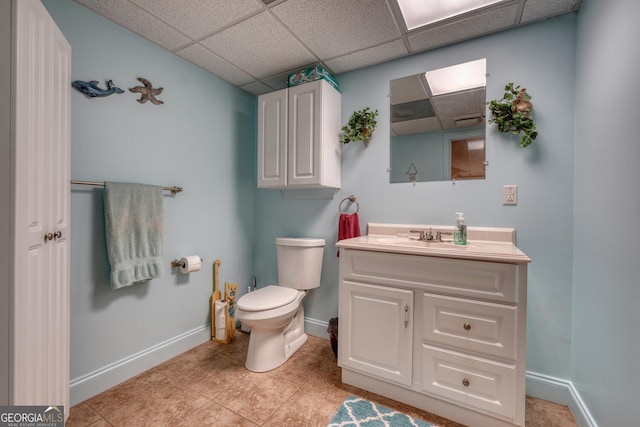 311 Lonesome Pine Trl, Blairsville, GA 30512 - bathroom with vanity, baseboards, a drop ceiling, toilet, and tile patterned flooring