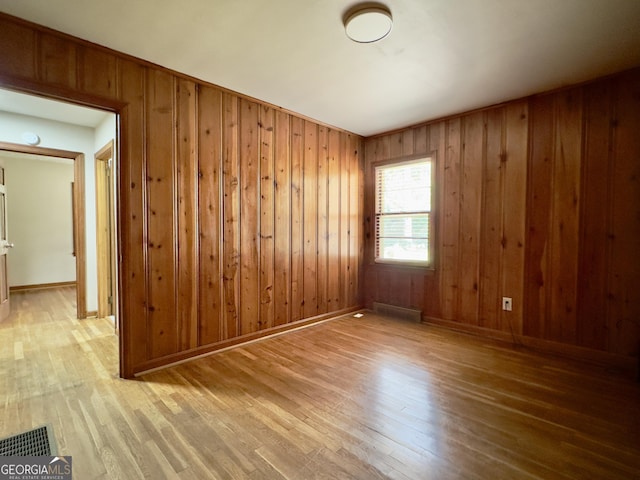 4 Walton Way NW, Rome, GA 30165 - unfurnished room featuring wood finished floors, wooden walls, and baseboards