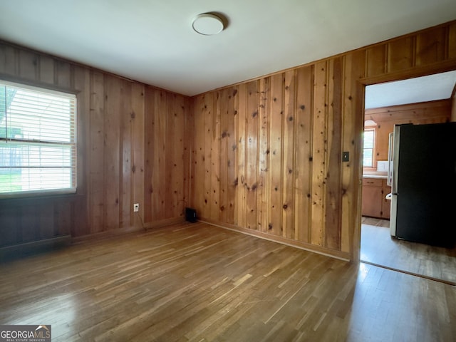 4 Walton Way NW, Rome, GA 30165 - empty room with light wood finished floors, wooden walls, and baseboards