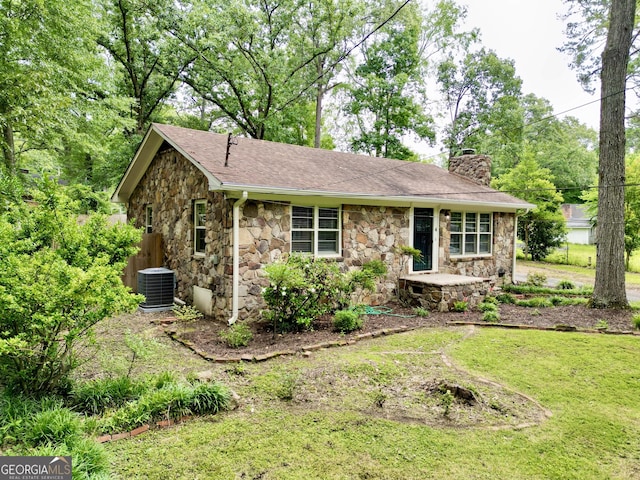 4 Walton Way NW, Rome, GA 30165 - view of front of house featuring stone siding, a chimney, central AC, and a shingled roof