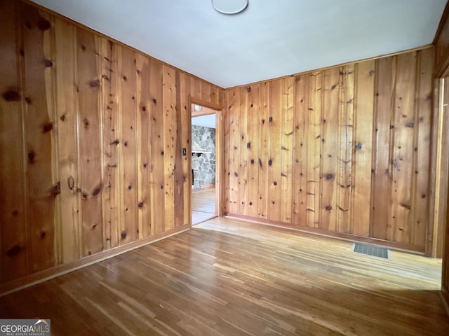 4 Walton Way NW, Rome, GA 30165 - unfurnished room with wood finished floors and wooden walls