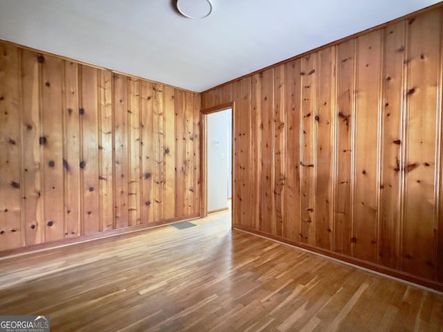 4 Walton Way NW, Rome, GA 30165 - spare room featuring wood finished floors, wood walls, and baseboards