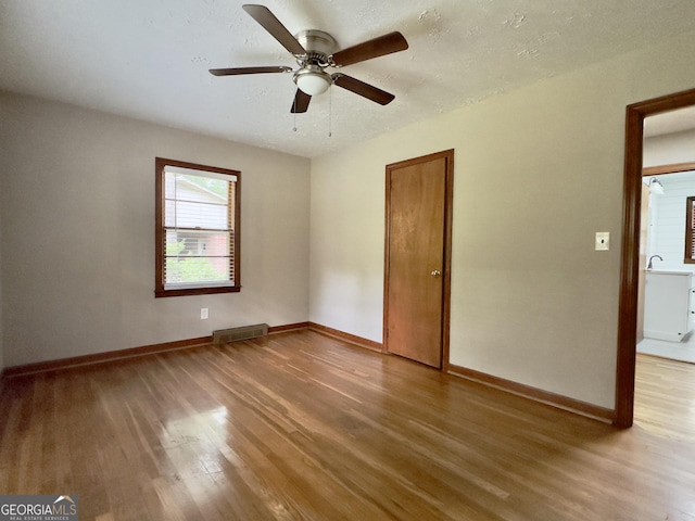 4 Walton Way NW, Rome, GA 30165 - spare room with wood finished floors, ceiling fan, and baseboards