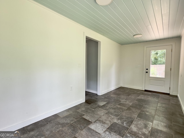4 Walton Way NW, Rome, GA 30165 - entryway with dark stone finish floors, baseboards, and wood ceiling