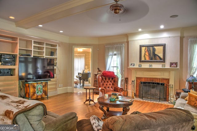 12001 Layfield Rd, Upatoi, GA 31829 - living area with crown molding, a ceiling fan, wood finished floors, a fireplace, and recessed lighting