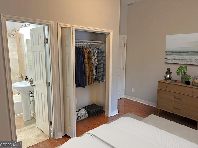 490 Rockwell St SW, Atlanta, GA 30310 - bedroom with wood finished floors, a closet, and connected bathroom