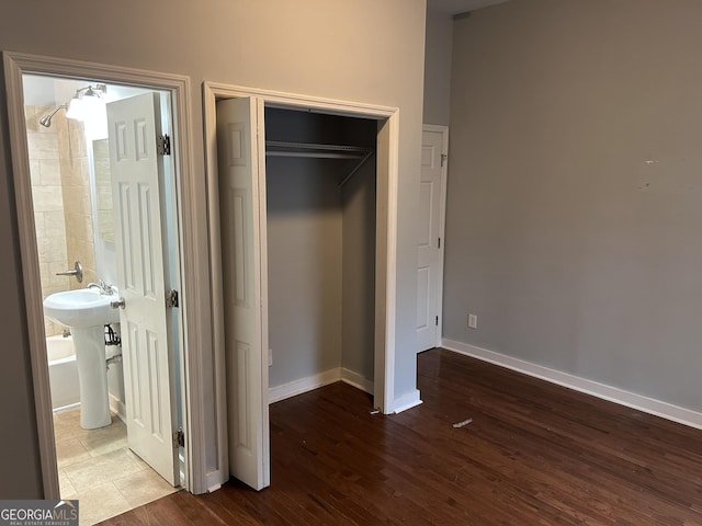 490 Rockwell St SW, Atlanta, GA 30310 - unfurnished bedroom featuring wood finished floors, a closet, and ensuite bathroom