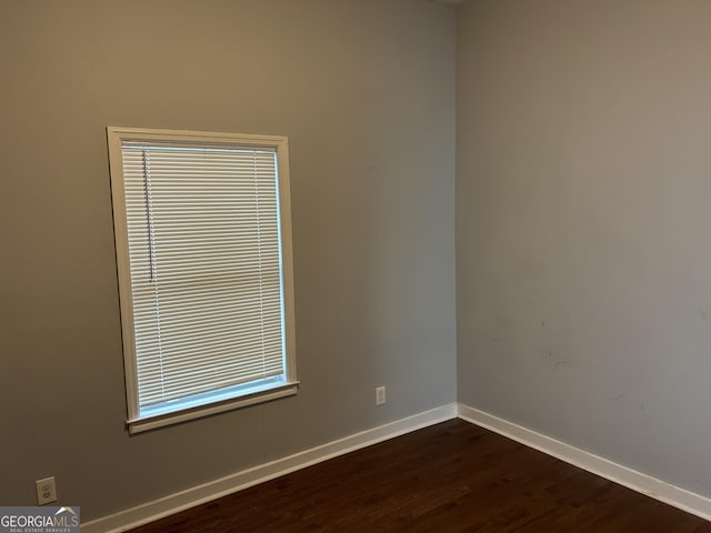 490 Rockwell St SW, Atlanta, GA 30310 - empty room with baseboards and dark wood-type flooring