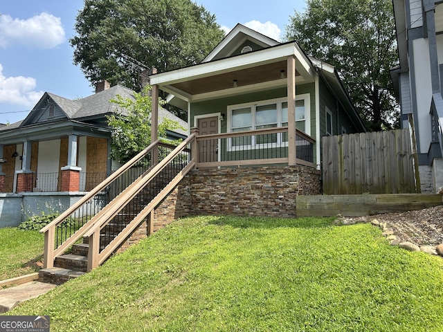 490 Rockwell St SW, Atlanta, GA 30310 - shotgun-style home featuring covered porch and stairway