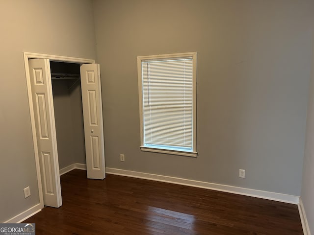 490 Rockwell St SW, Atlanta, GA 30310 - unfurnished bedroom with dark wood-style flooring and a closet