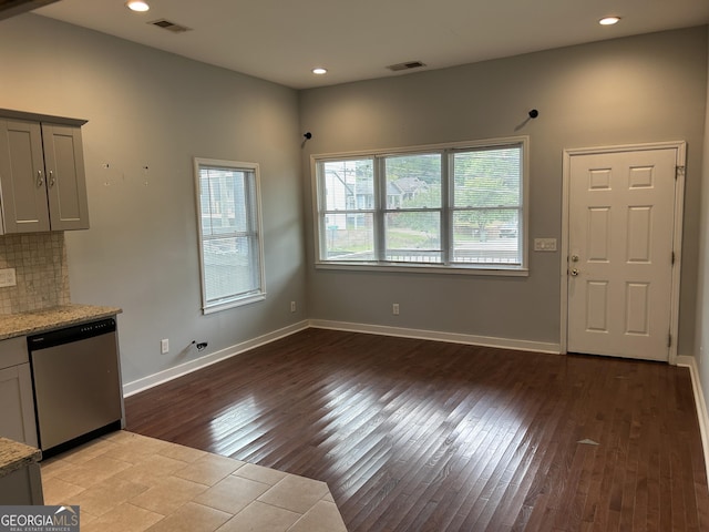 490 Rockwell St SW, Atlanta, GA 30310 - kitchen with stainless steel dishwasher, light wood finished floors, light stone countertops, recessed lighting, and gray cabinetry