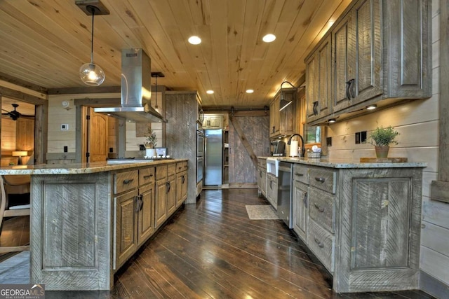 190 Toccoa Heights Rd, Blue Ridge, GA 30513 - kitchen featuring island exhaust hood, dark wood finished floors, appliances with stainless steel finishes, recessed lighting, and light stone counters