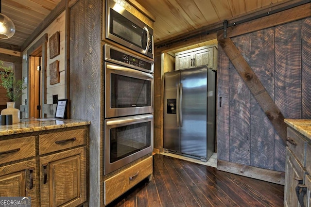 190 Toccoa Heights Rd, Blue Ridge, GA 30513 - kitchen with appliances with stainless steel finishes, wooden ceiling, dark wood-style flooring, and light stone countertops