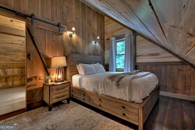 190 Toccoa Heights Rd, Blue Ridge, GA 30513 - bedroom with wood walls, vaulted ceiling, a barn door, wood finished floors, and wood ceiling