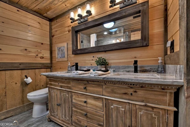 190 Toccoa Heights Rd, Blue Ridge, GA 30513 - bathroom featuring double vanity, wooden walls, toilet, wood finished floors, and wooden ceiling