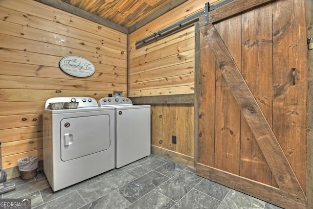 190 Toccoa Heights Rd, Blue Ridge, GA 30513 - laundry area with independent washer and dryer, wooden walls, wood ceiling, and a barn door