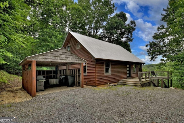 190 Toccoa Heights Rd, Blue Ridge, GA 30513 - view of home's exterior with a deck, metal roof, and a carport