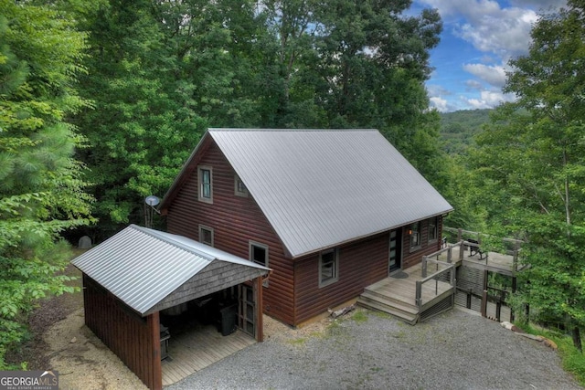 190 Toccoa Heights Rd, Blue Ridge, GA 30513 - view of front of property with a wooden deck, metal roof, and a wooded view