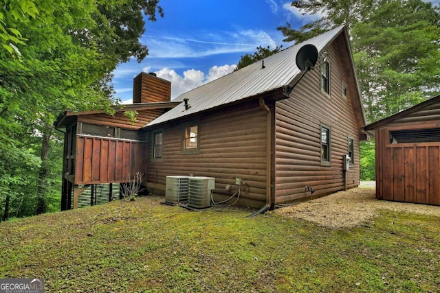 190 Toccoa Heights Rd, Blue Ridge, GA 30513 - view of property exterior with central air condition unit, a chimney, faux log siding, and metal roof