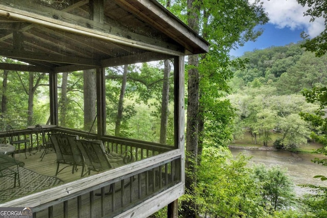 190 Toccoa Heights Rd, Blue Ridge, GA 30513 - deck featuring outdoor dining space, a water view, and a wooded view