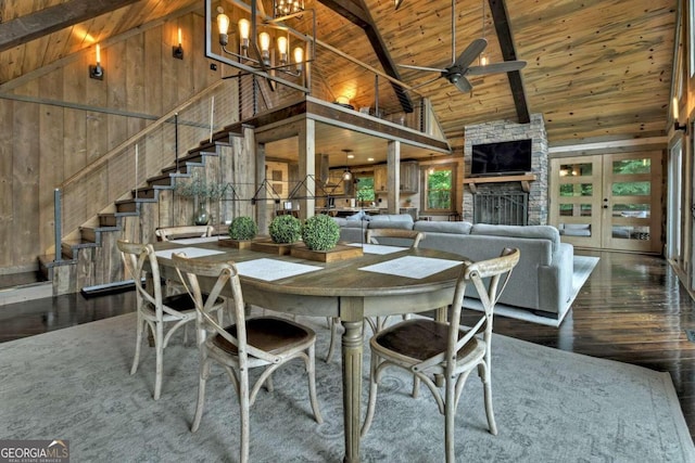 190 Toccoa Heights Rd, Blue Ridge, GA 30513 - dining area with wood ceiling with exposed beams, hardwood / wood-style flooring, high vaulted ceiling, wooden walls, and stairs
