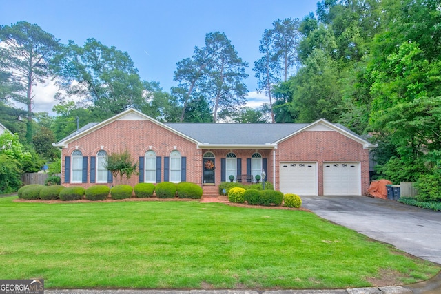 17 Rosewood Rd SW, Rome, GA 30165 - view of front of property with brick siding, a front yard, a garage, and driveway