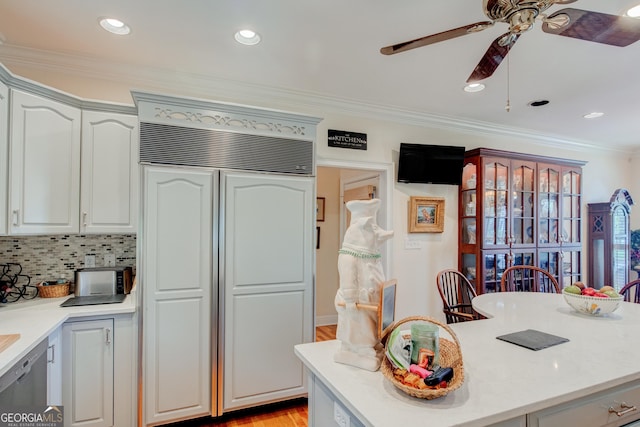 17 Rosewood Rd SW, Rome, GA 30165 - kitchen with paneled built in fridge, ceiling fan, light countertops, ornamental molding, and a kitchen island