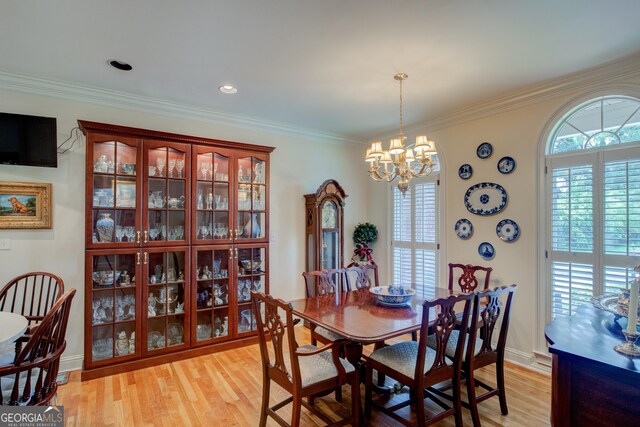17 Rosewood Rd SW, Rome, GA 30165 - dining area featuring light wood-style floors, a chandelier, crown molding, and baseboards