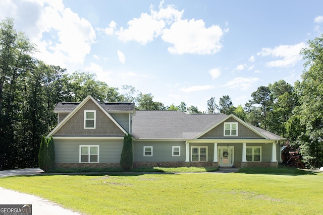1325 Adams Rd, Meansville, GA 30256 - craftsman-style home with a front yard, a porch, and stone siding