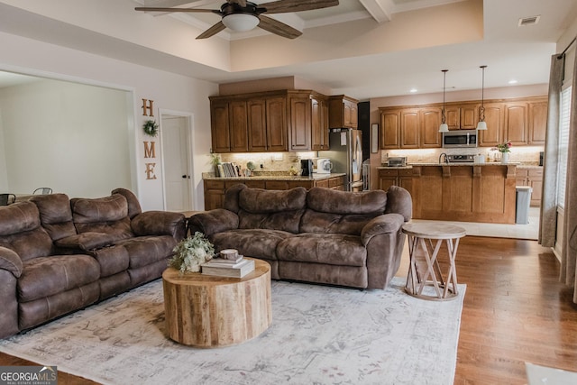 1325 Adams Rd, Meansville, GA 30256 - living area featuring a ceiling fan, recessed lighting, beamed ceiling, light wood-style flooring, and ornamental molding
