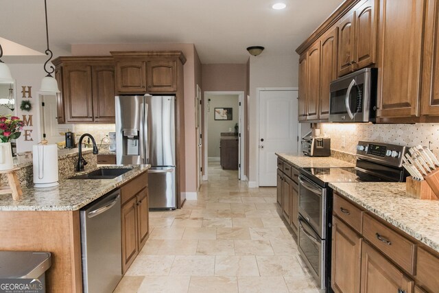 1325 Adams Rd, Meansville, GA 30256 - kitchen featuring stainless steel appliances, a sink, backsplash, and light stone counters