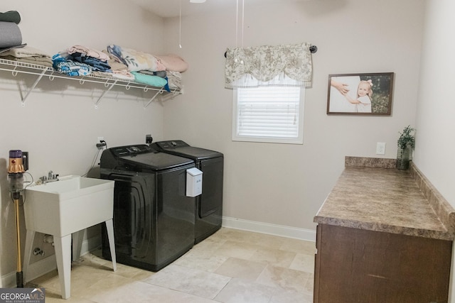 1325 Adams Rd, Meansville, GA 30256 - laundry room with washer and clothes dryer and baseboards