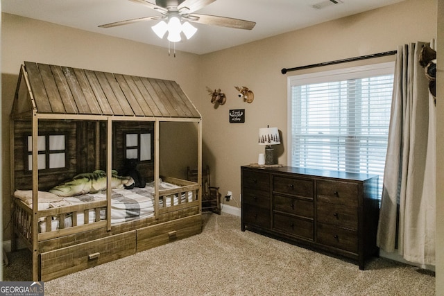 1325 Adams Rd, Meansville, GA 30256 - carpeted bedroom with baseboards and ceiling fan