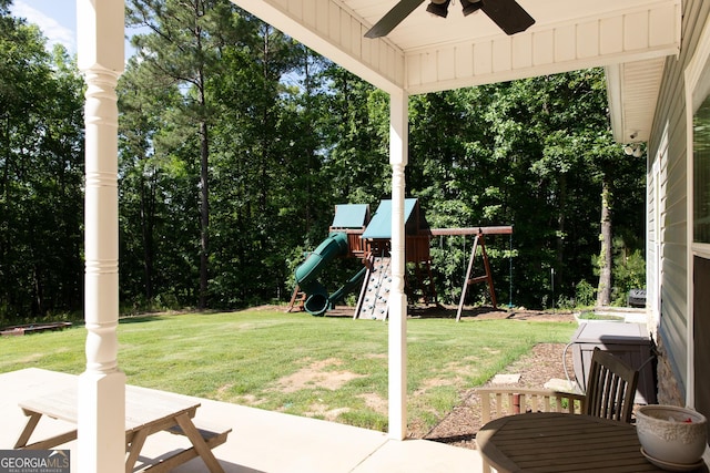 1325 Adams Rd, Meansville, GA 30256 - view of green lawn with a playground, a ceiling fan, and a patio