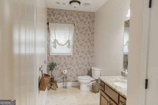 1325 Adams Rd, Meansville, GA 30256 - bathroom featuring wallpapered walls, vanity, toilet, and baseboards
